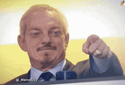 A Man In A Suit And Tie Points At The Camera GIF