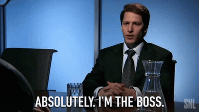A Man In A Suit And Tie Says Absolutely I 'M The Boss While Sitting At A Table GIF
