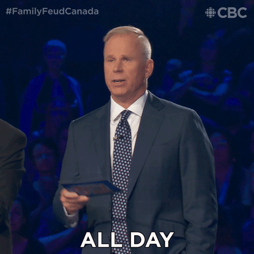 A Man In A Suit And Tie Says " All Day " In Front Of A Crowd GIF