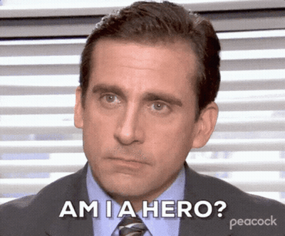 A Man In A Suit And Tie Says Am Ia Hero GIF