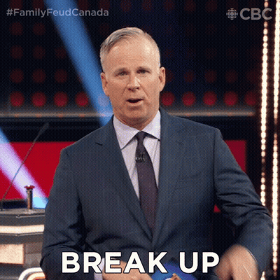 A Man In A Suit And Tie Says Break Up On A Stage GIF