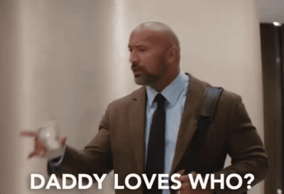 A Man In A Suit And Tie Says Daddy Loves Who . GIF