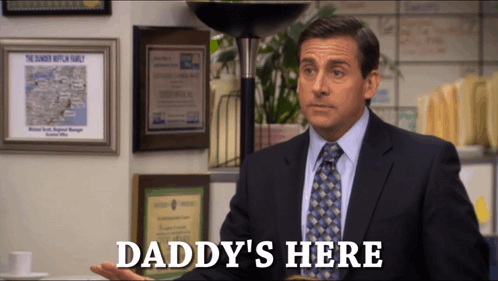 A Man In A Suit And Tie Says " Daddy 'S Here " In Front Of A Lamp GIF