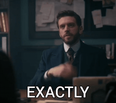 A Man In A Suit And Tie Says Exactly In Front Of A Laptop Computer GIF