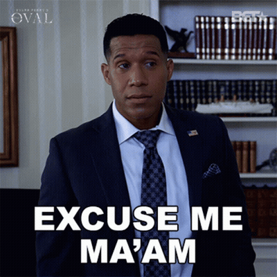 A Man In A Suit And Tie Says " Excuse Me Ma 'Am " GIF
