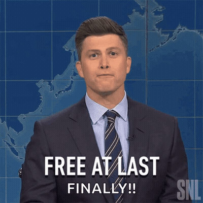 a man in a suit and tie says free at last