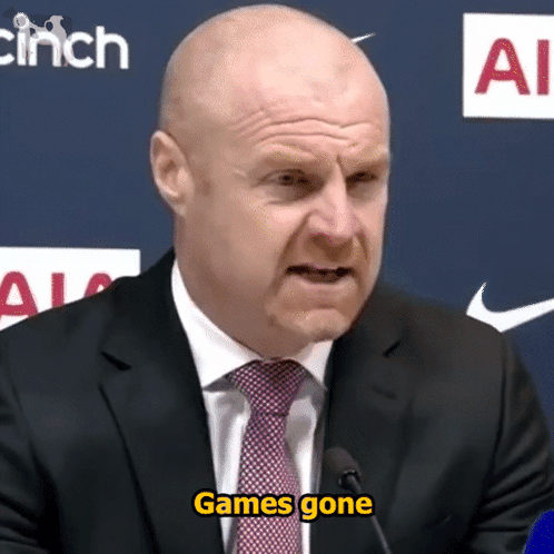 A Man In A Suit And Tie Says " Games Gone " At A Press Conference GIF