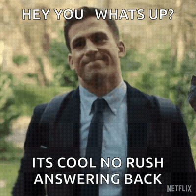 A Man In A Suit And Tie Says Hey You Whats Up GIF