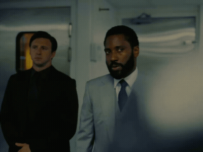 A Man In A Suit And Tie Says " I Ordered My Hot Sauce An Hour Ago " In A Dark Room GIF