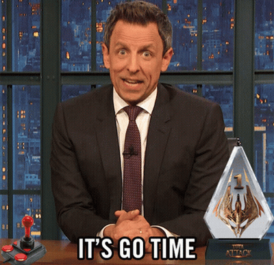 A Man In A Suit And Tie Says It 'S Go Time In Front Of A Video Game Controller GIF