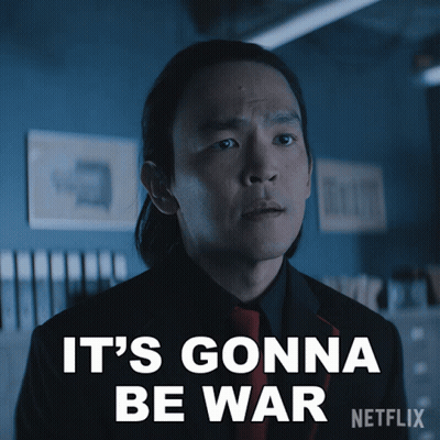 A Man In A Suit And Tie Says It 'S Gonna Be War On A Netflix Poster GIF