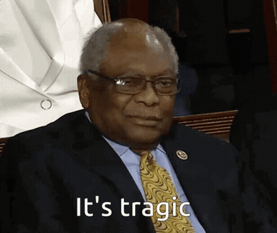 A Man In A Suit And Tie Says It 'S Tragic While Sitting In A Chair GIF