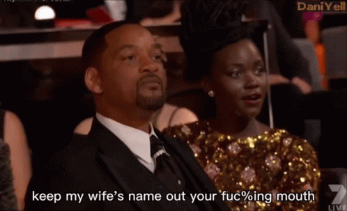 A Man In A Suit And Tie Says " Keep My Wife 'S Name Out Your Fucking Mouth " GIF