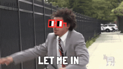 A Man In A Suit And Tie Says Let Me In In Front Of A Fence GIF