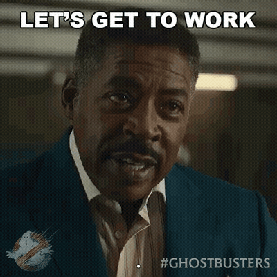 A Man In A Suit And Tie Says " Let 'S Get To Work " GIF