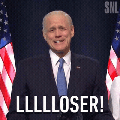 A Man In A Suit And Tie Says Lllloser GIF