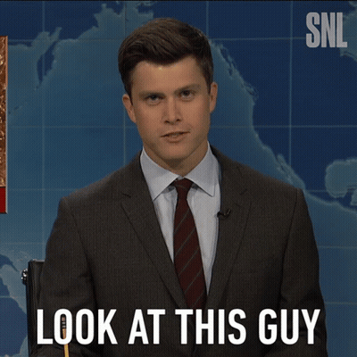 A Man In A Suit And Tie Says Look At This Guy In Front Of A Map GIF