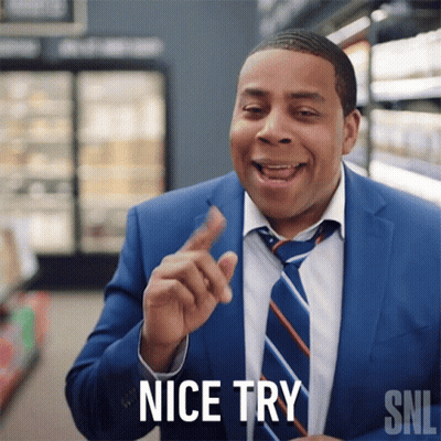 A Man In A Suit And Tie Says " Nice Try " In A Supermarket GIF