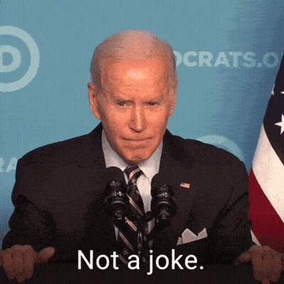 A Man In A Suit And Tie Says " Not A Joke " In Front Of A Flag GIF