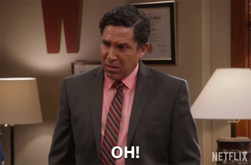 A Man In A Suit And Tie Says Oh In A Netflix Ad GIF
