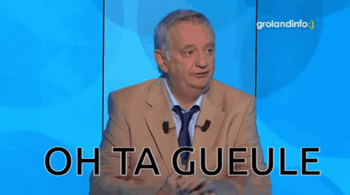 A Man In A Suit And Tie Says Oh Ta Gueule On A Blue Background GIF