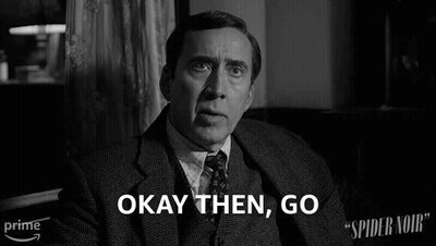 A Man In A Suit And Tie Says Okay Then Go In A Black And White Photo GIF