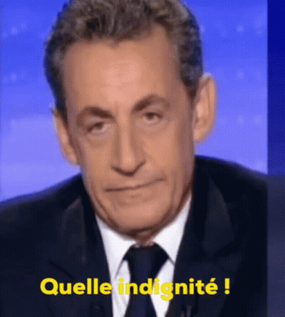 A Man In A Suit And Tie Says " Quella Indignite " In Yellow GIF