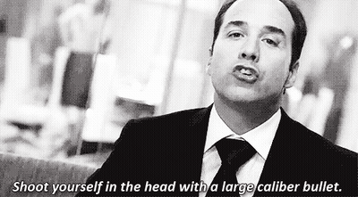 A Man In A Suit And Tie Says Shoot Yourself In The Head With A Large Caliber Bullet . GIF