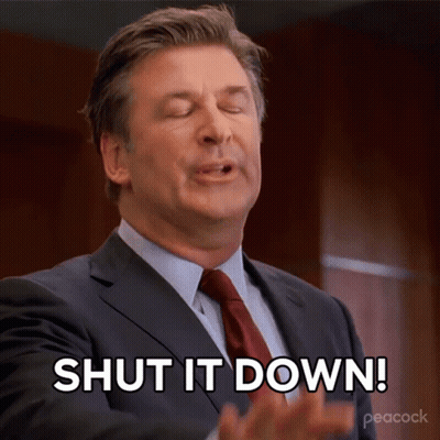 A Man In A Suit And Tie Says Shut It Down With His Eyes Closed GIF