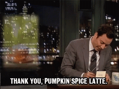 A Man In A Suit And Tie Says " Thank You Pumpkin Spice Latte " While Writing In A Notebook GIF