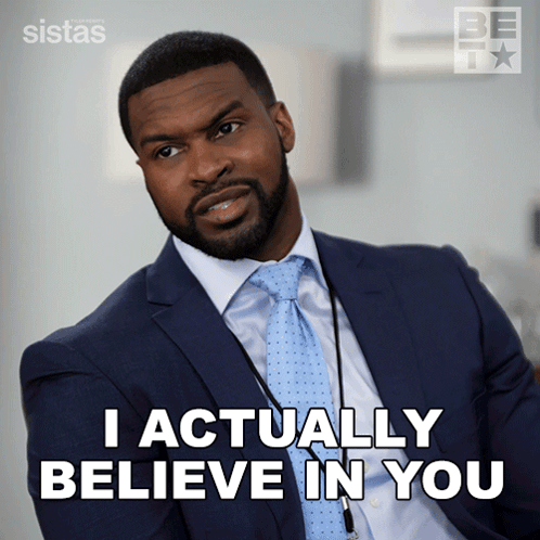 A Man In A Suit And Tie Says That He Actually Believes In You GIF