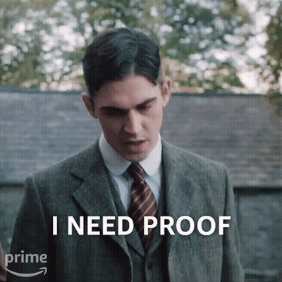 A Man In A Suit And Tie Says That He Needs Proof GIF