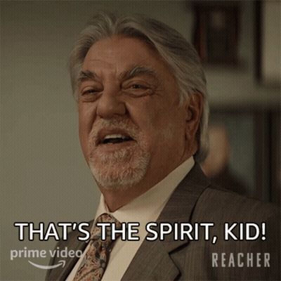 A Man In A Suit And Tie Says That 'S The Spirit Kid Reacher GIF