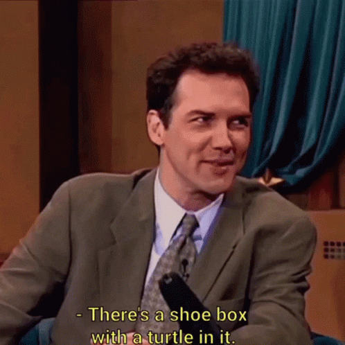 A Man In A Suit And Tie Says There Is A Shoe Box With A Turtle In It GIF