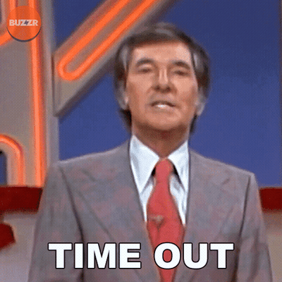 A Man In A Suit And Tie Says Time Out In Front Of A Buzzr Logo GIF