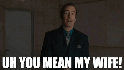 A Man In A Suit And Tie Says Uh You Mean My Wife . GIF