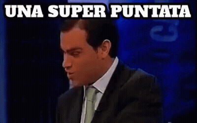 A Man In A Suit And Tie Says Una Super Puntata On A Blue Background GIF