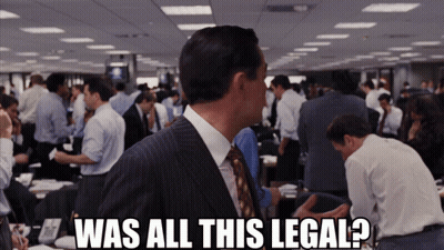 A Man In A Suit And Tie Says Was All This Legal In Front Of A Crowd Of People GIF