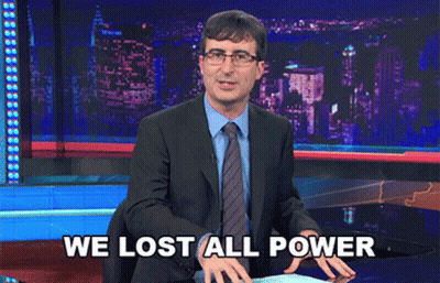 A Man In A Suit And Tie Says " We Lost All Power " On A Stage GIF