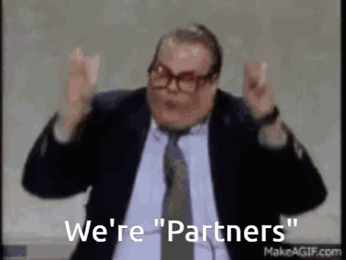 A Man In A Suit And Tie Says We 'Re " Partners " GIF