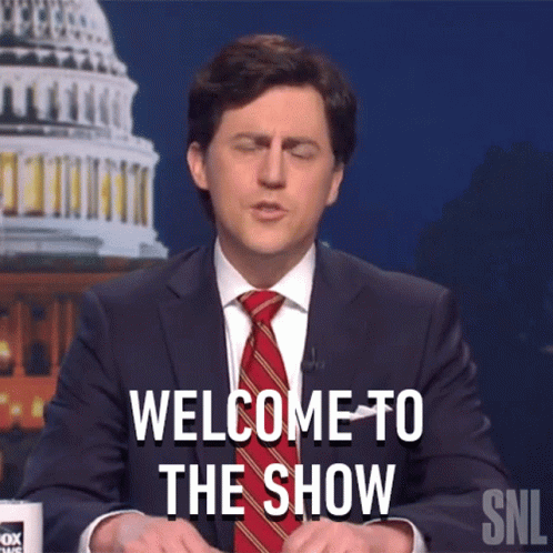A Man In A Suit And Tie Says Welcome To The Show On Snl GIF