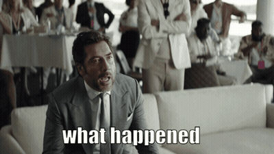 A Man In A Suit And Tie Says " What Happened " In Front Of A Crowd GIF