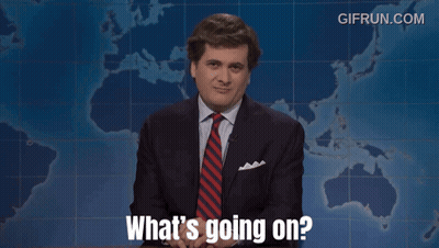 A Man In A Suit And Tie Says What 'S Going On In Front Of A Map GIF