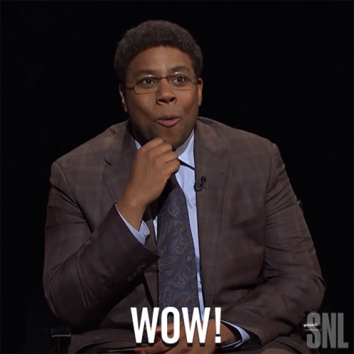 A Man In A Suit And Tie Says Wow In A Snl Ad GIF