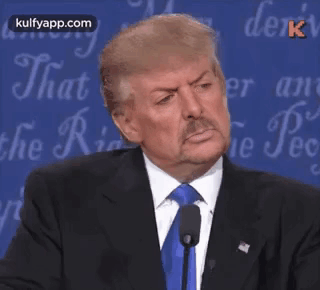 A Man In A Suit And Tie Says Wrong In Front Of A Blue Background GIF