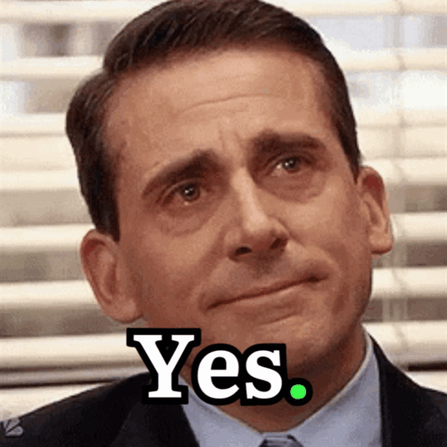 A Man In A Suit And Tie Says Yes On His Face GIF