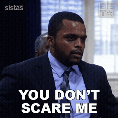 A Man In A Suit And Tie Says You Don T Scare Me GIF