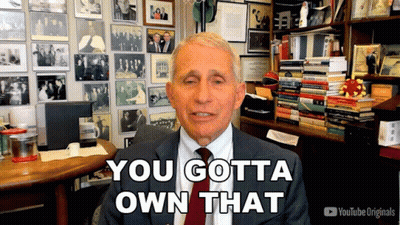 A Man In A Suit And Tie Says You Gotta Own That In Front Of A Wall Of Pictures GIF