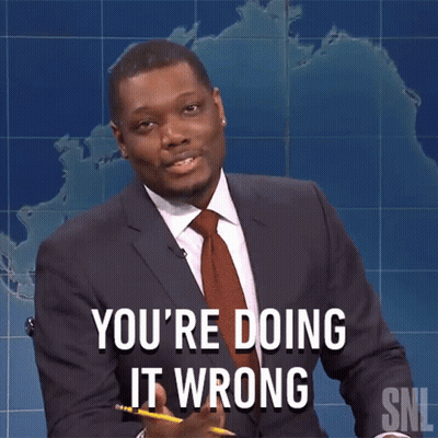 A Man In A Suit And Tie Says You 'Re Doing It Wrong While Holding A Pencil GIF
