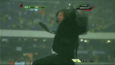 A Man In A Suit And Tie Screams While Watching A Soccer Game GIF